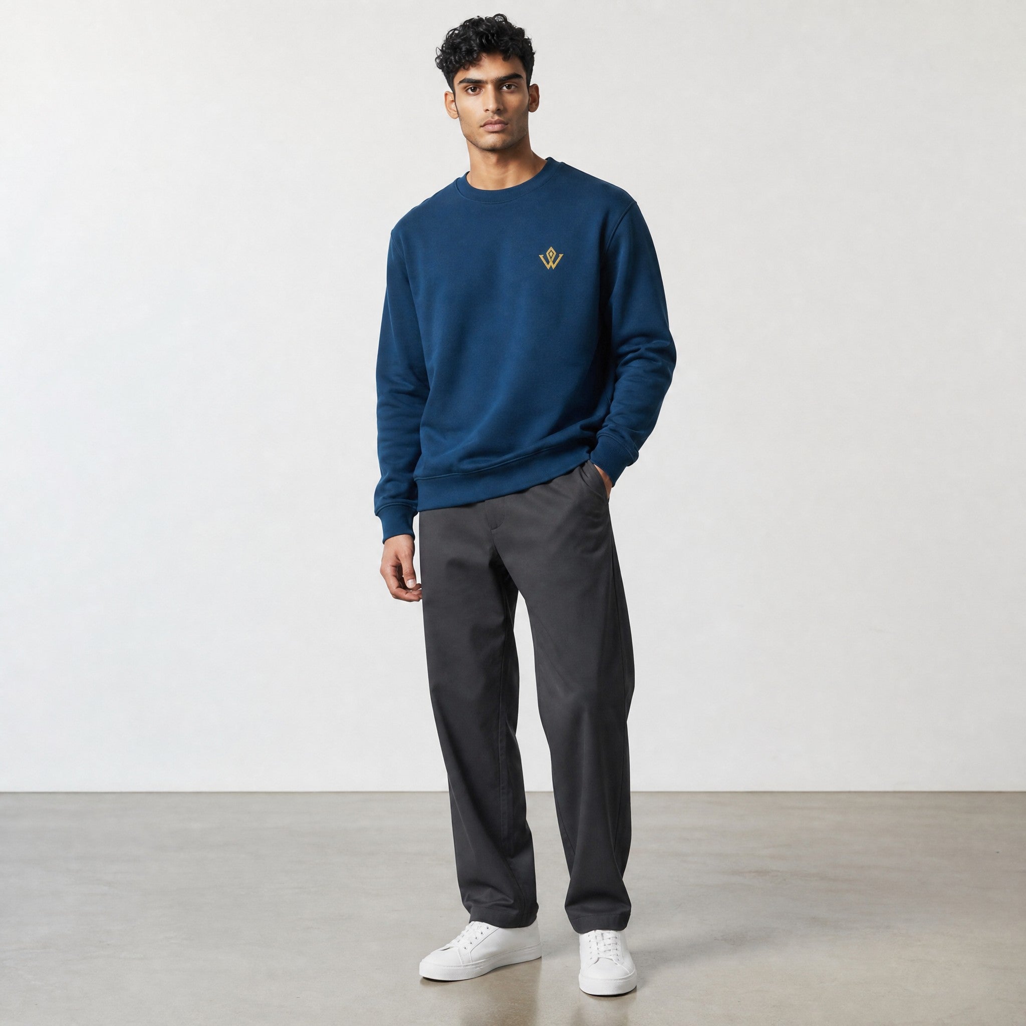 VVID Essential Sweatshirt in deep teal, crew neck, long sleeves, 100% combed cotton, with embroidered gold logo on chest.