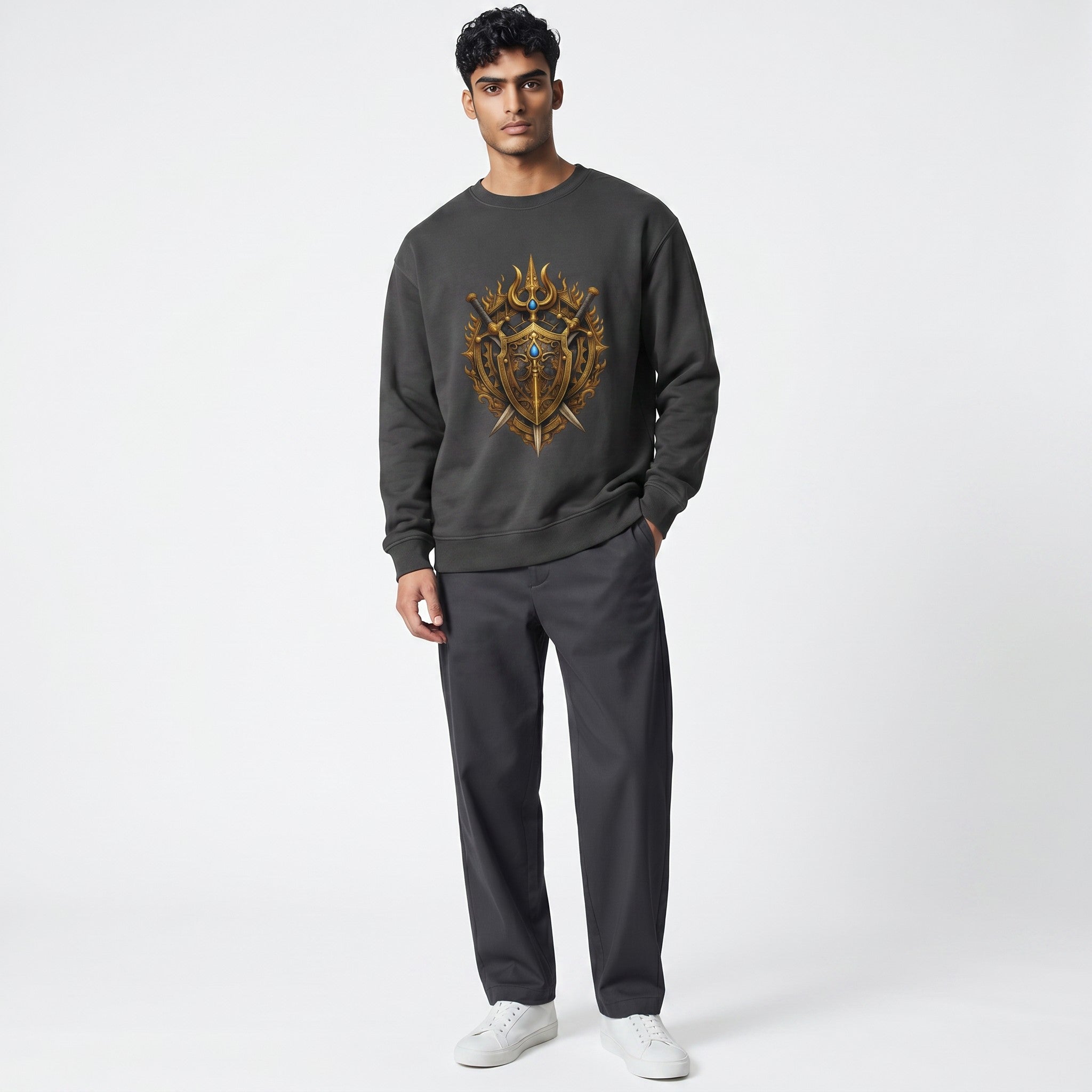 VVID Essentials dark grey crewneck sweatshirt with a detailed gold warrior crest featuring swords and blue gems.