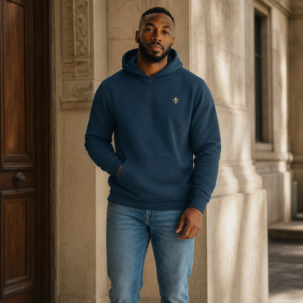 VVID - Indian Artisan Luxury Fashion House unisex dark teal cotton blend hoodie with gold logo emblem and front pocket.
